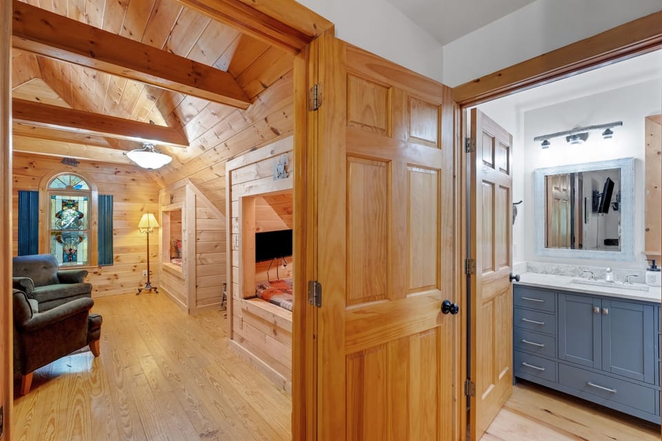 Loft with 2 built-in Custom Cubbies with XL Twin memory foam mattresses each with private Smart TV with ROKU