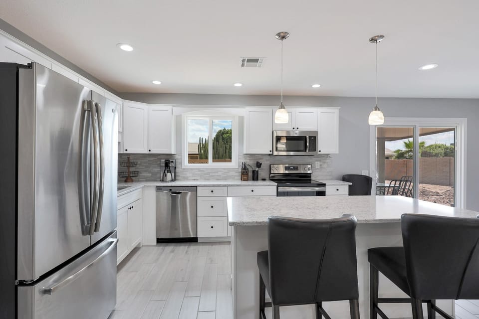 Fully stocked w/ All Clad pots & pans and utensils for all your cooking needs!