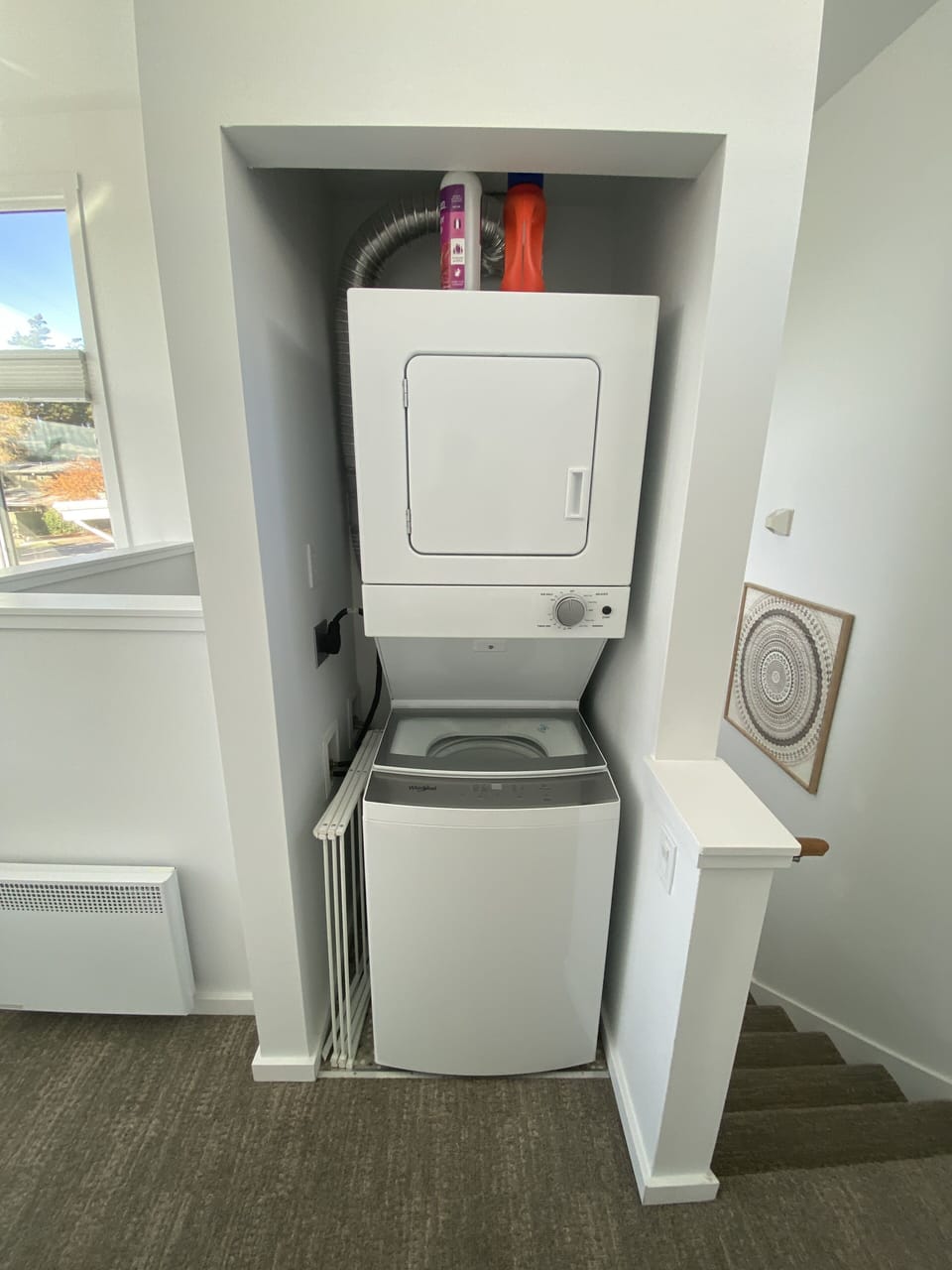Washer and dryer are in a downstairs closet.