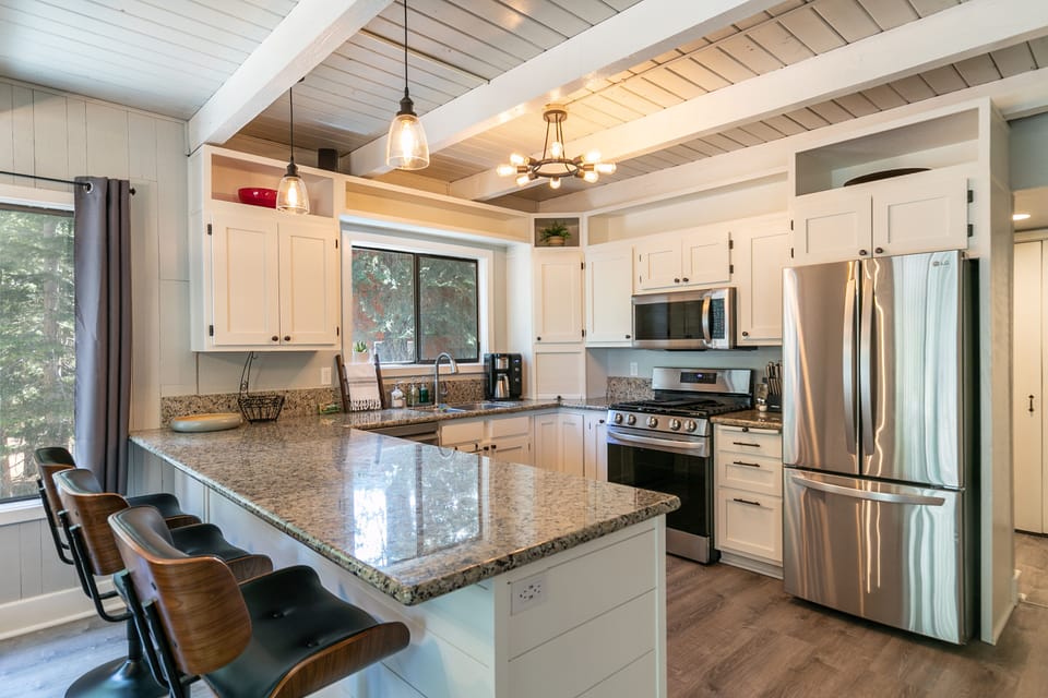 Kitchen boasts granite counter tops and stainless steel appliances