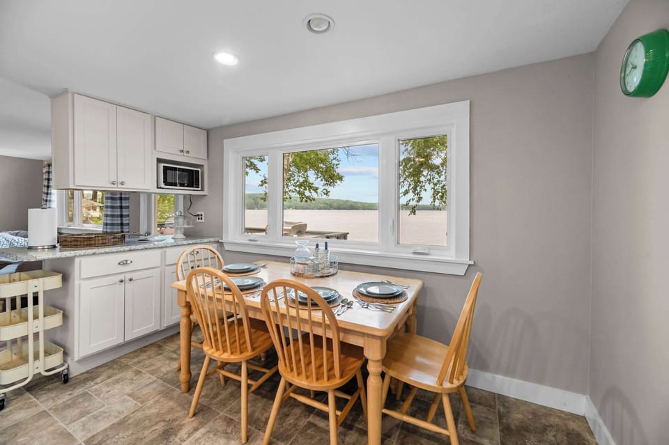 Gather around the table for family meals, morning coffee, or game night while enjoying beautiful views of Cobbosseecontee Lake just outside the window—making every meal part of your lakeside getaway.