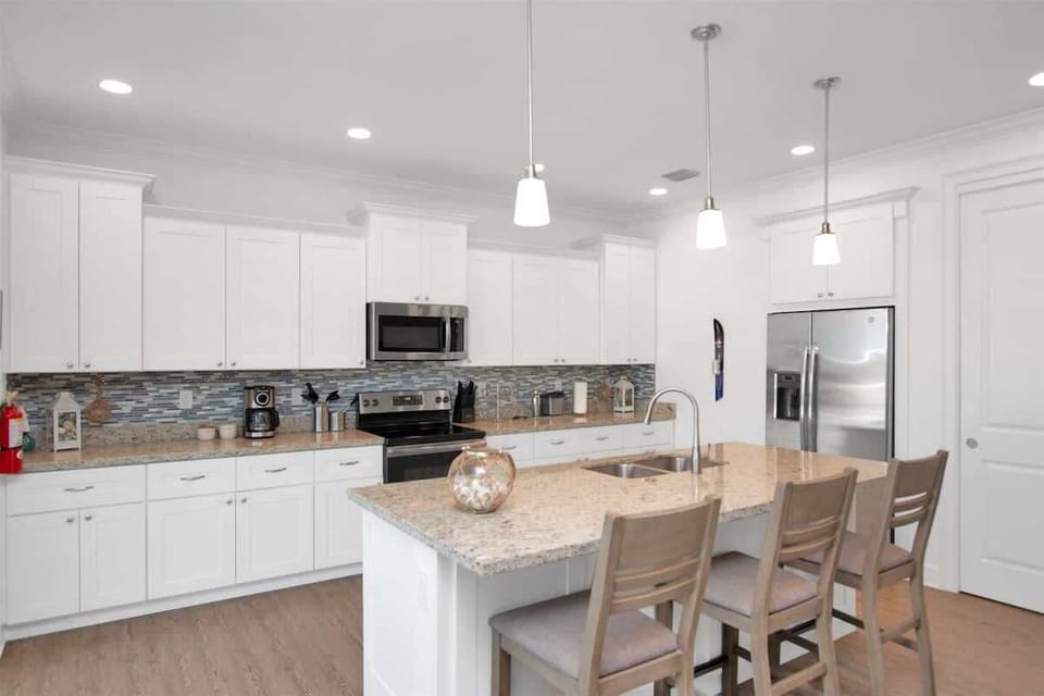 Kitchen area with bar seating for 3