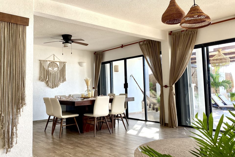 Dining room features a custom-made dining table for up to 12 guests.