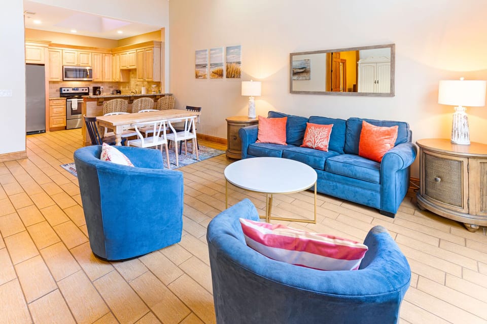 Open floor plan showing living room, dining area, and kitchen