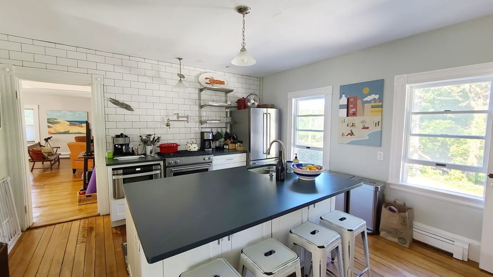 Kitchen has large island and counter seating