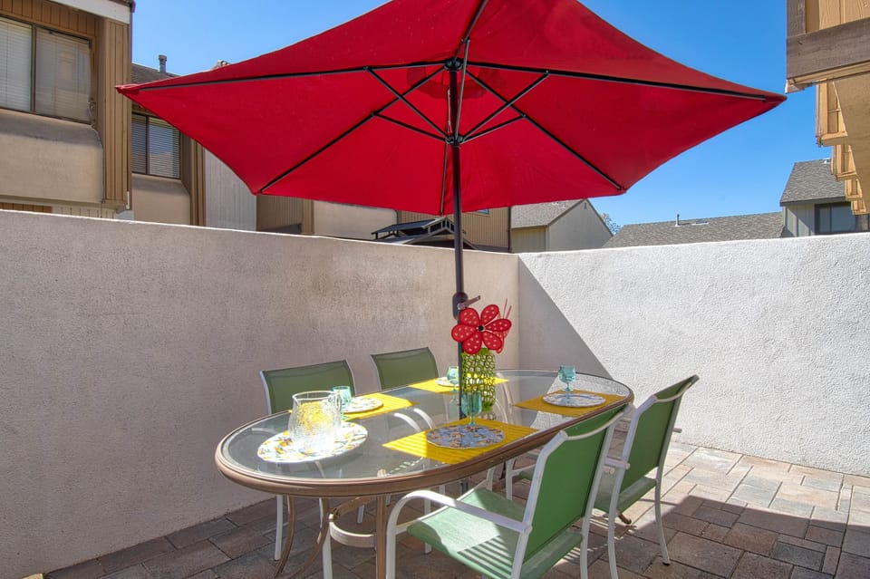 - Dine outdoors on your private patio with a bright umbrella for shade   - Comfortable seating for meals or evening drinks with friends   - Enjoy fresh air and a cozy atmosphere at your outdoor dining area