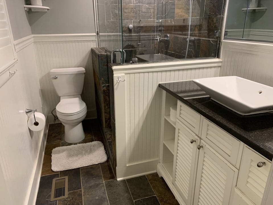 Master bathroom with wall in shower 