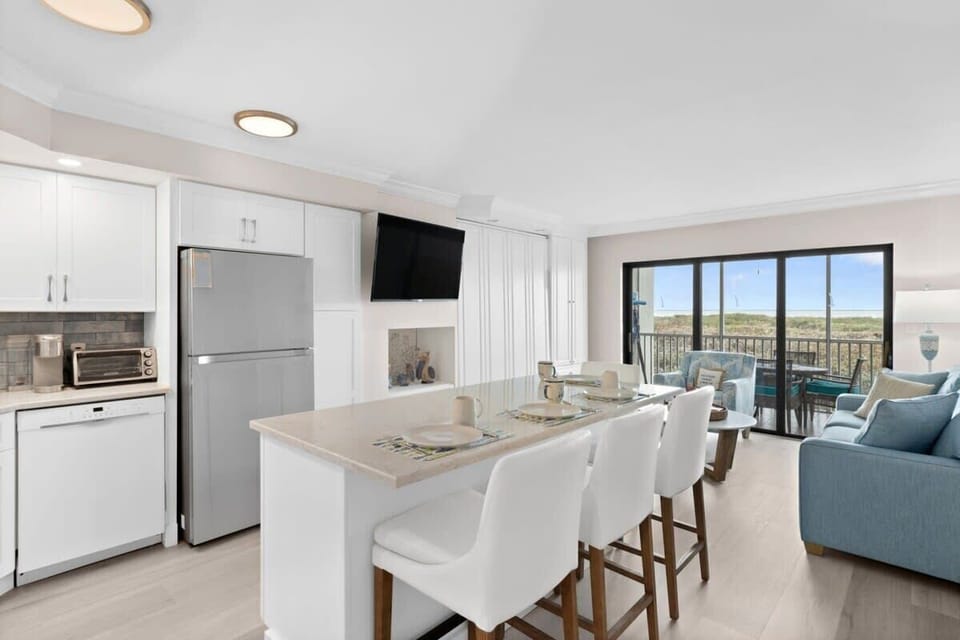 The open concept living dining area is spacious and bright
