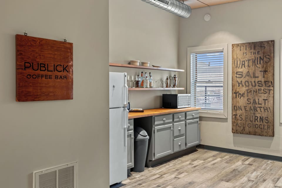 Kitchen area with windows overlooking the back parking lot