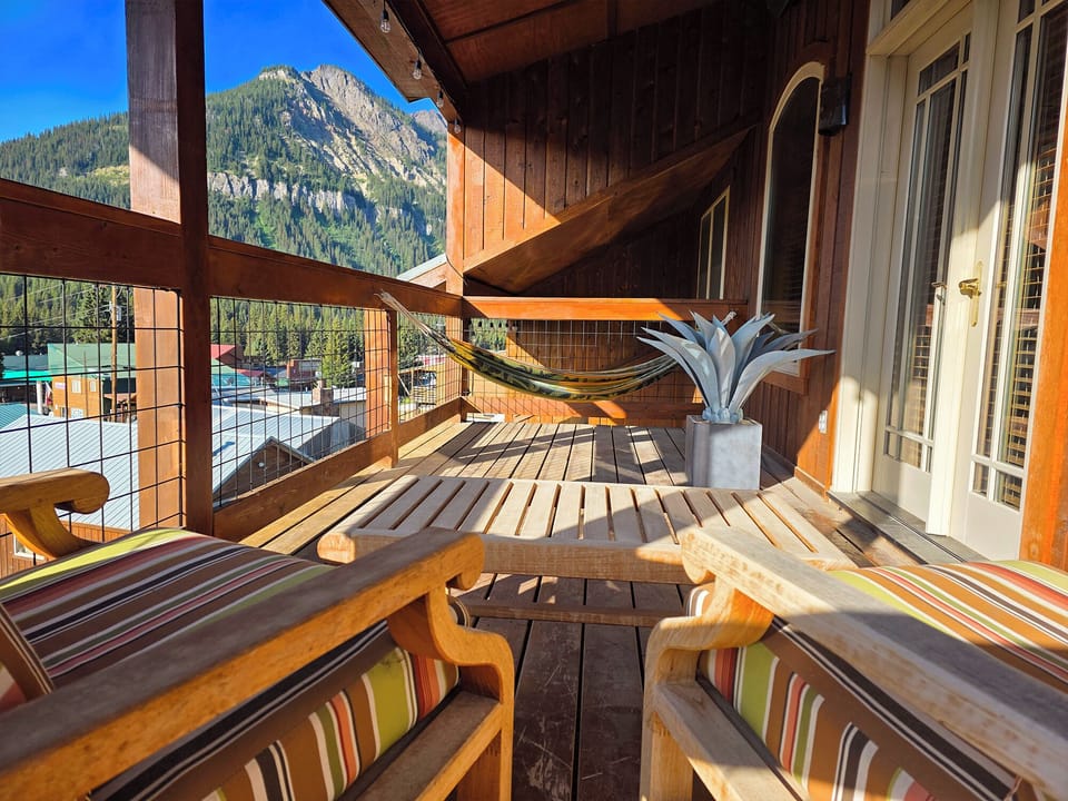 Relax in the Teak loungers / hammock and enjoy the view from the private balcony