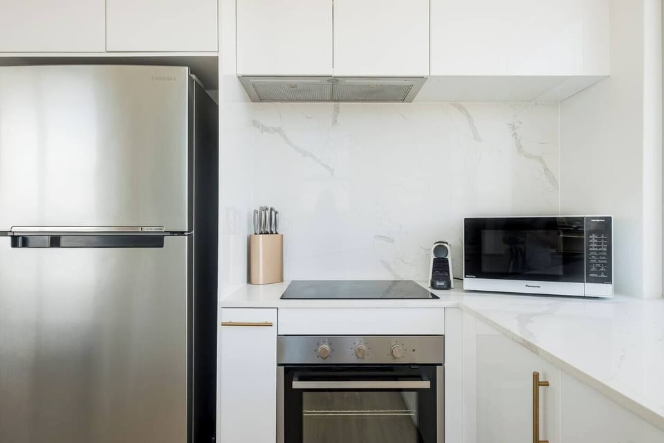 Kitchen includes large refrigerator, microwave, oven, dishwasher, etc