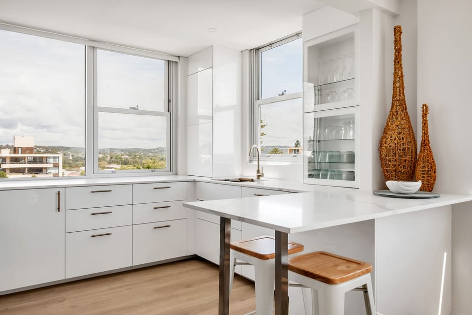 Light bright kitchen with breakfast bar and plenty of light and district views.