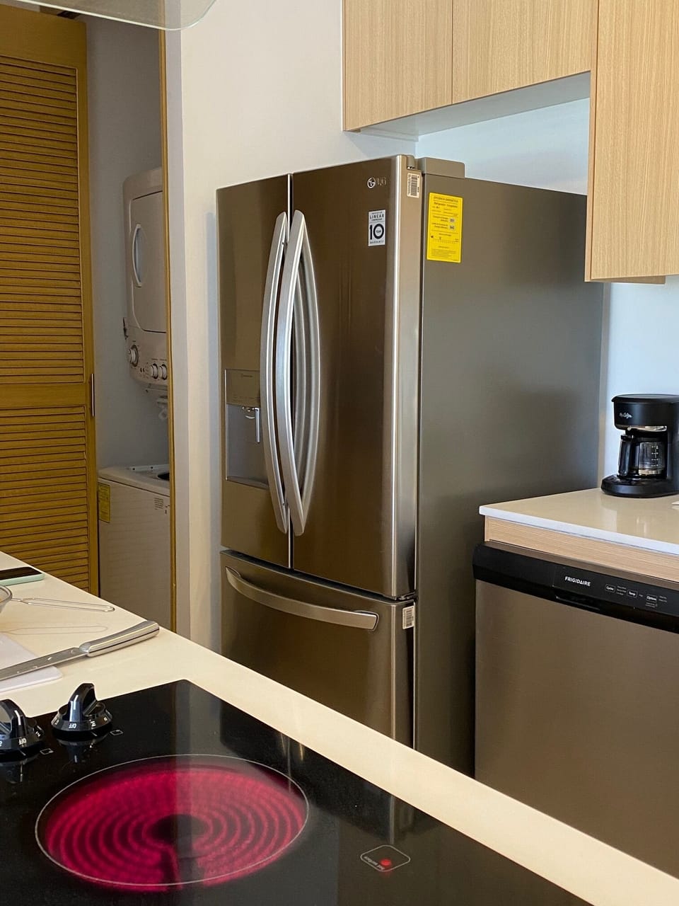 Fully equipped kitchen including a fridge with ice maker and filtered water
