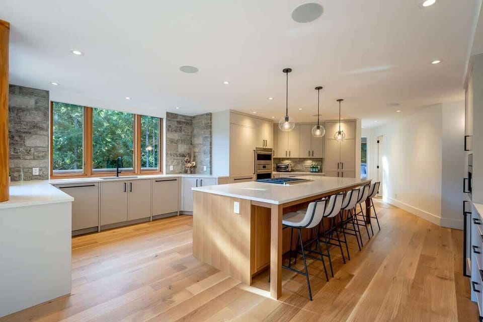 A spacious gourmet kitchen features all-new high-end appliances