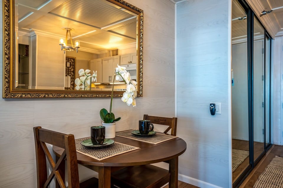 Enjoy your morning coffee at this cozy dining nook, where elegant touches and thoughtful design create the perfect spot to start your day.