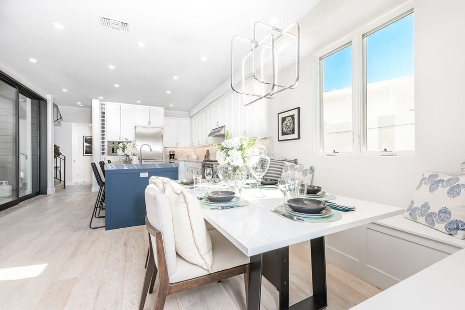 The dining area comfortably seats 5–6 guests, creating the perfect setting for elevated meals
                