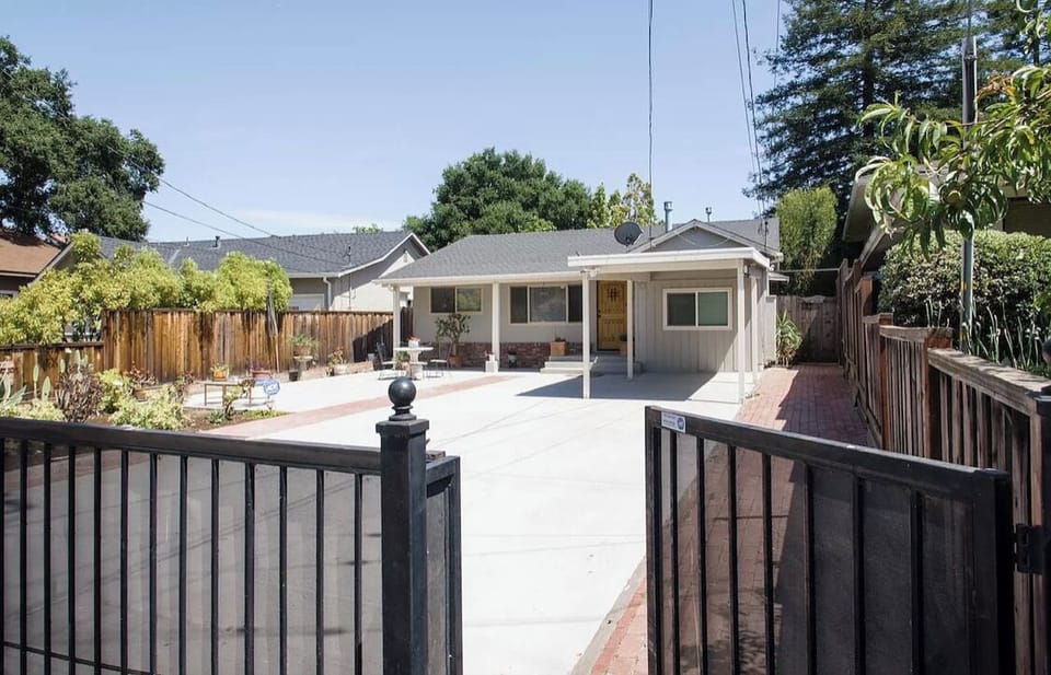 Gated home with 3 parking spaces inside the gate 