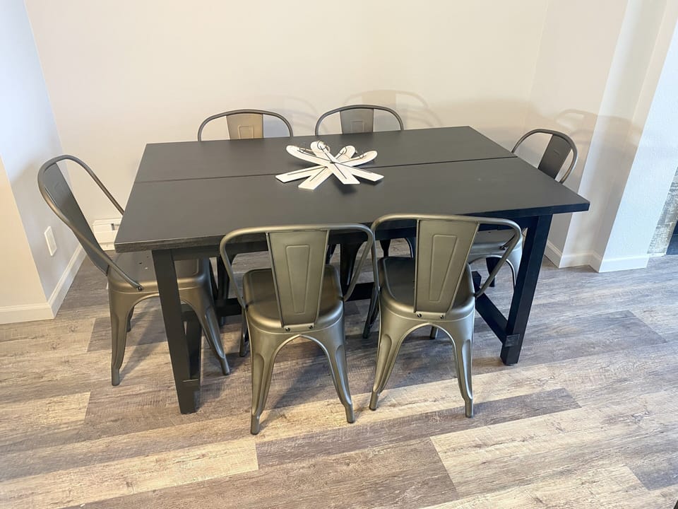 Dining area with seating for six plus four more at the bar