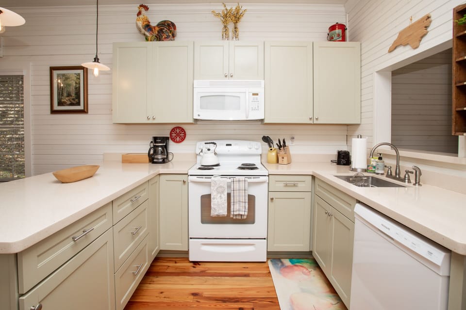 Fully stocked kitchen with pots, pans and Fiestaware dishes