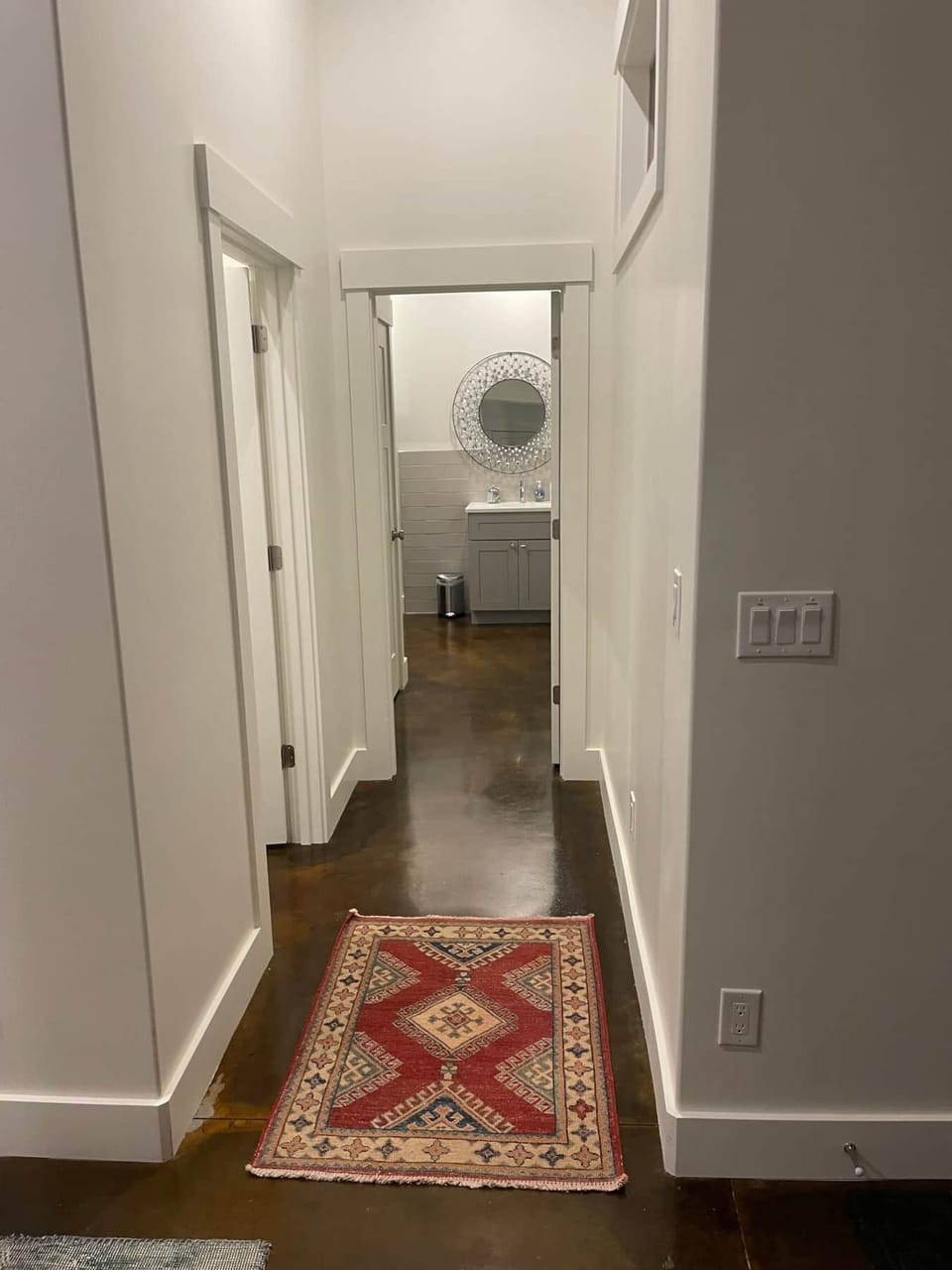 34 Upstream Bachelor Sanctuary hallway leading to two full bathrooms and laundry area on first floor