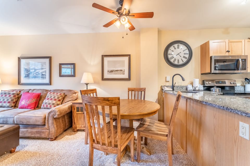 Gather around the warm wood dining table while your meal simmers on the full kitchen's granite counters.