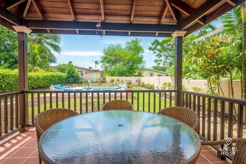 The covered patio dining table can seat 6 and has a lovely view of the pool!