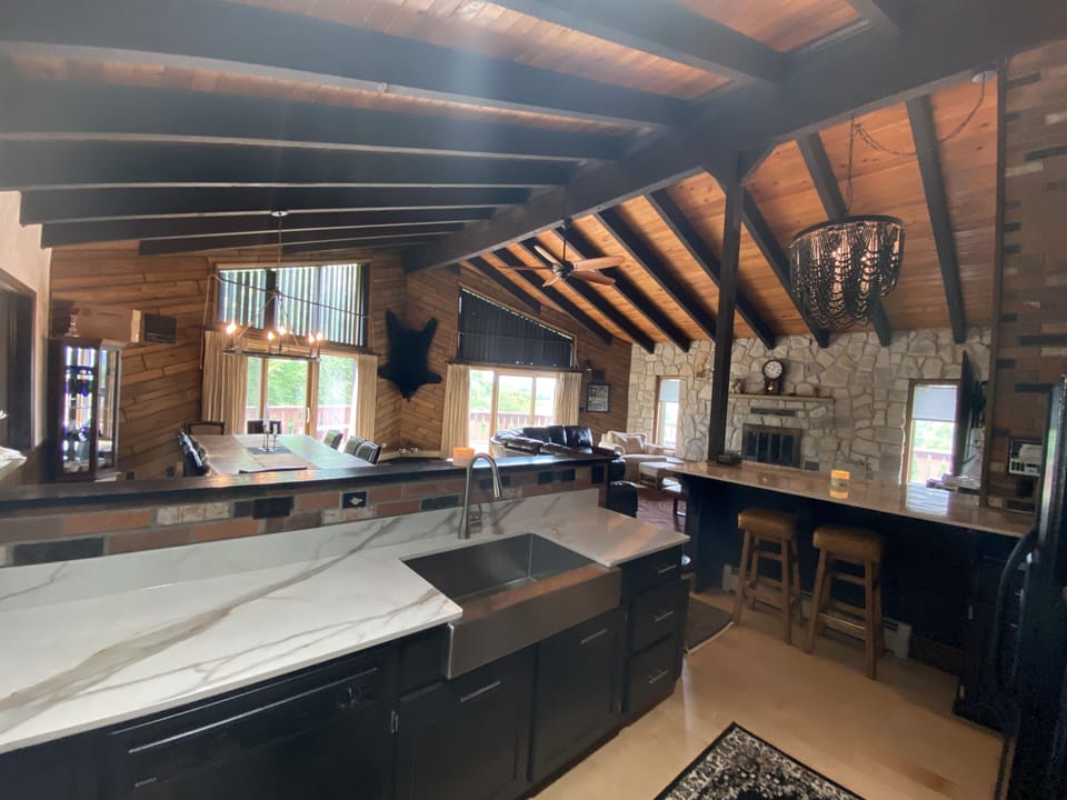 The newly redone kitchen overlooks a great room.