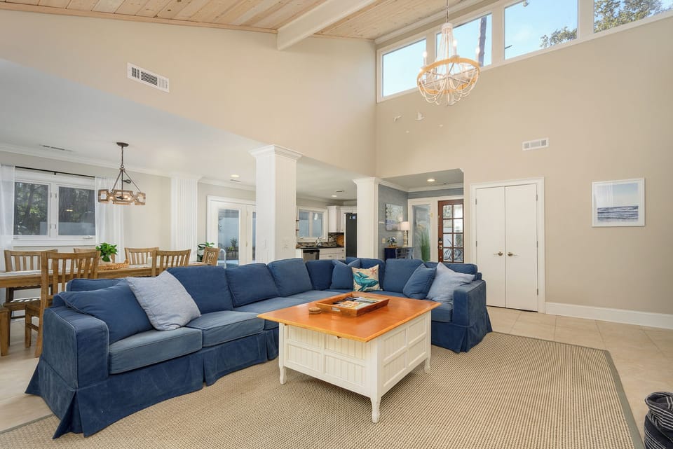 View of living room, dinning room, kitchen and front door from the sun room