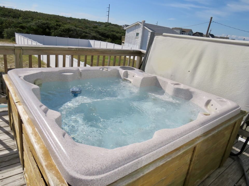 Hot Tub - Hot tub and a great view of the pool, this mid- level deck is perfect for relaxing under the shade.