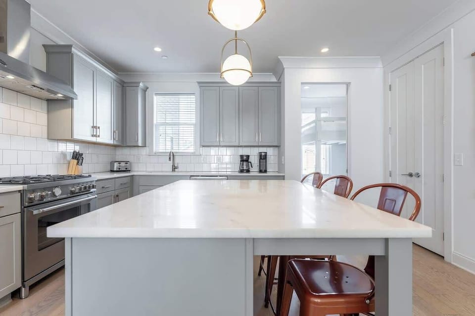 Modern elegance awaits with stainless steel appliances and warm, inviting decor!