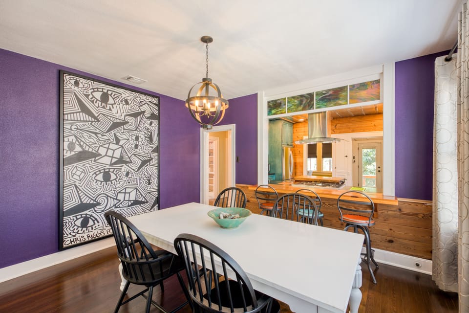 Dining room table offers seating for 4, or sit 3 at the bar.