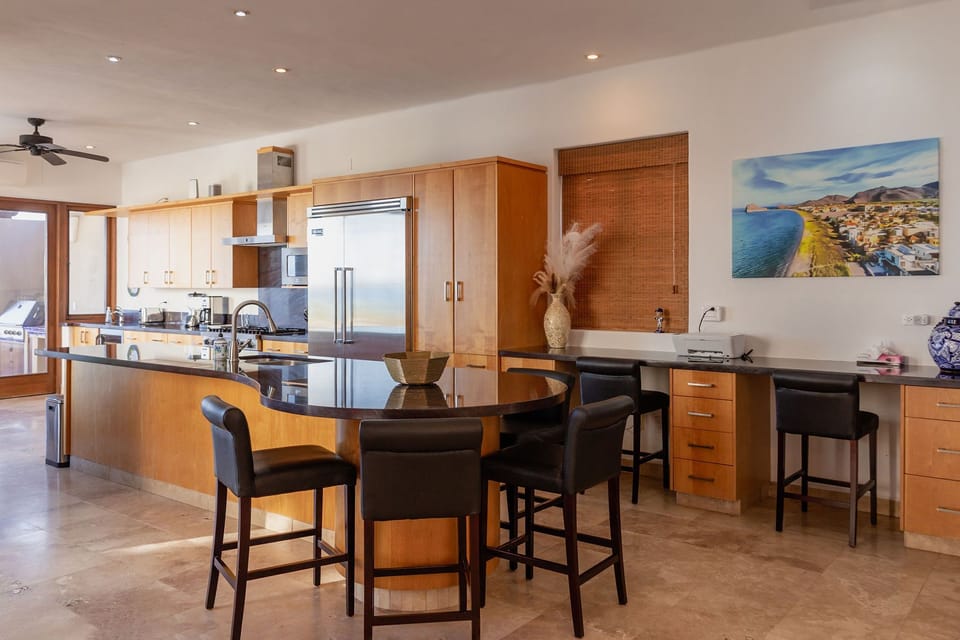 Large kitchen with desk workspace.