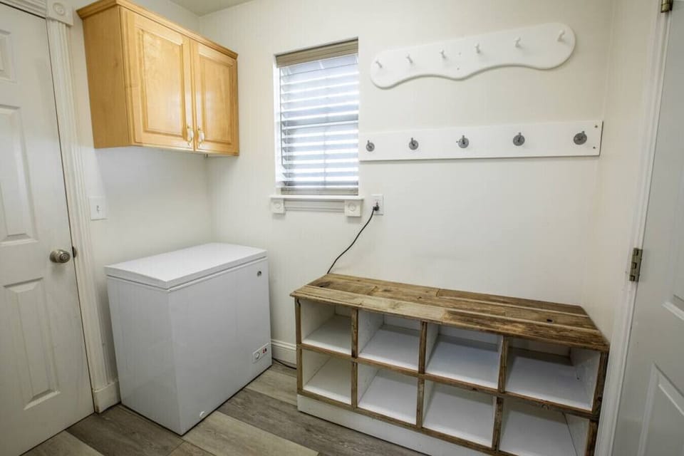 Convenient mudroom with bench seating and built-in storage.