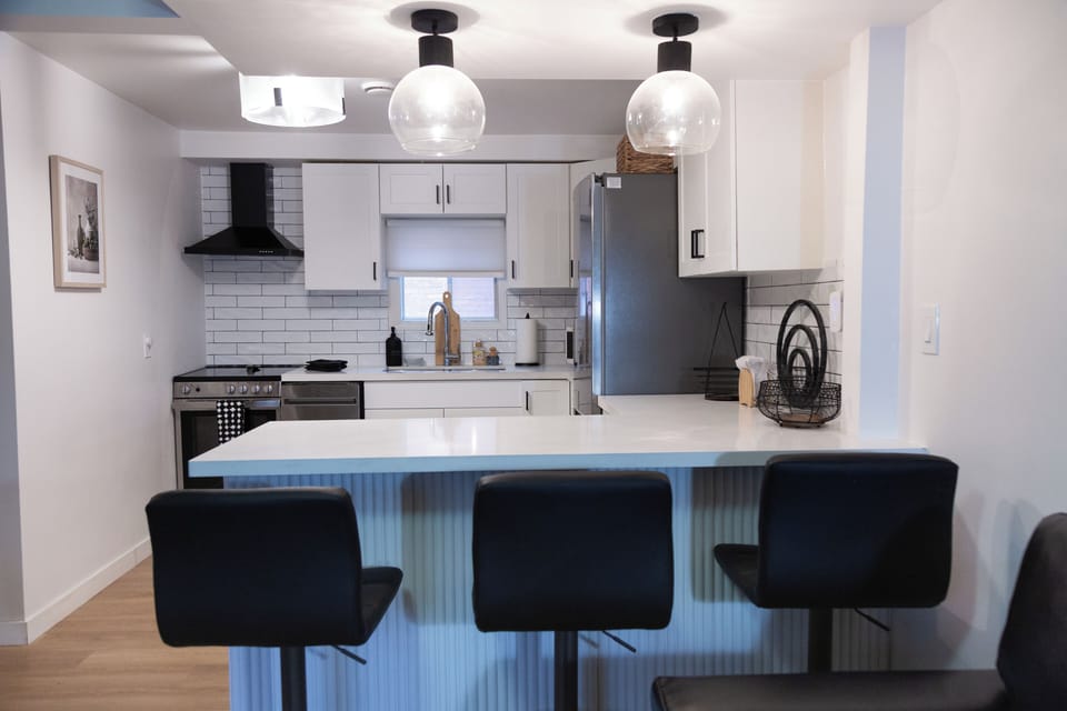 Bar seating at kitchen counter.