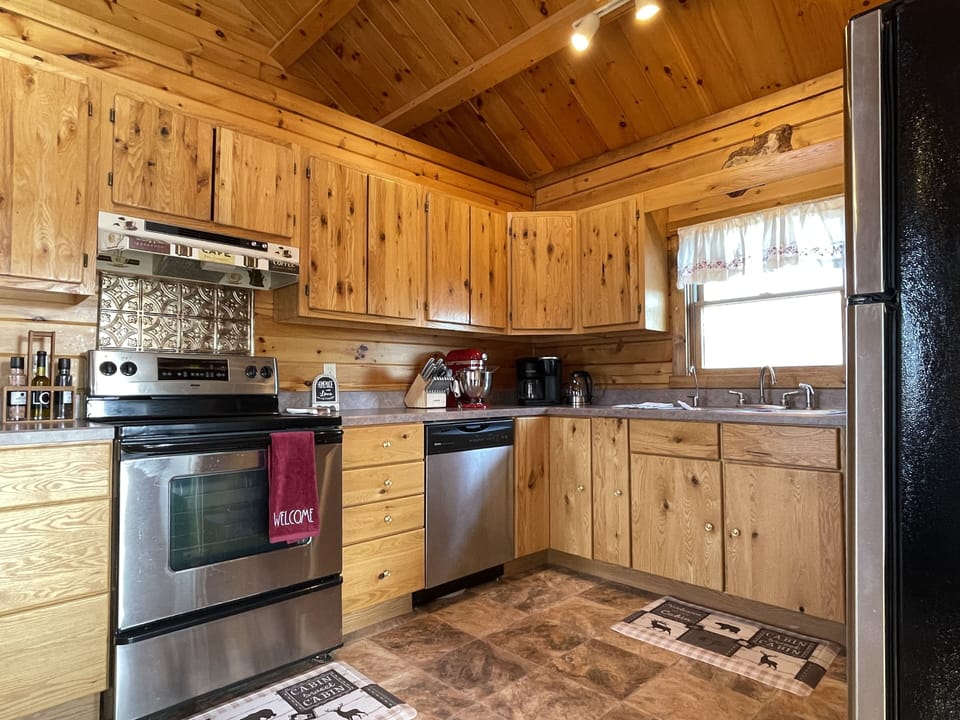 Large, updated kitchen with modern appliances makes preparing meals a pleasure