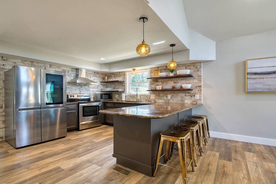 Lower level kitchen and breakfast bar with seating for 4.