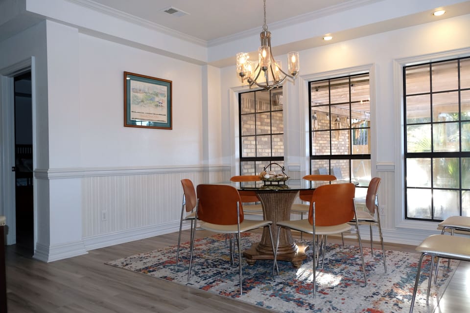dining room table and  chairs with extra chairs available. stunning outside view