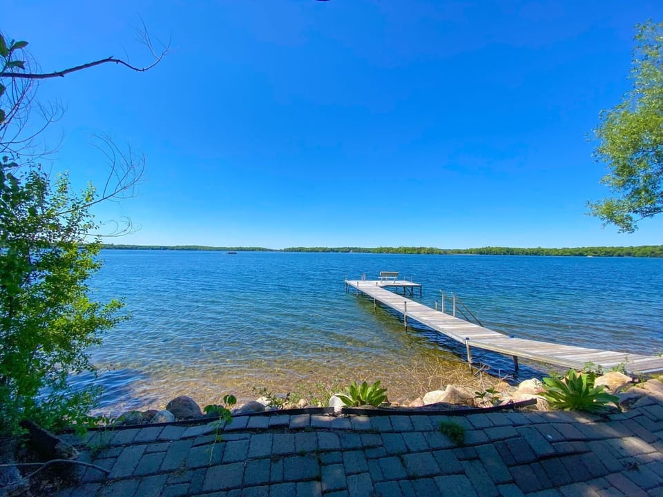 view from stone patio at lake's edge