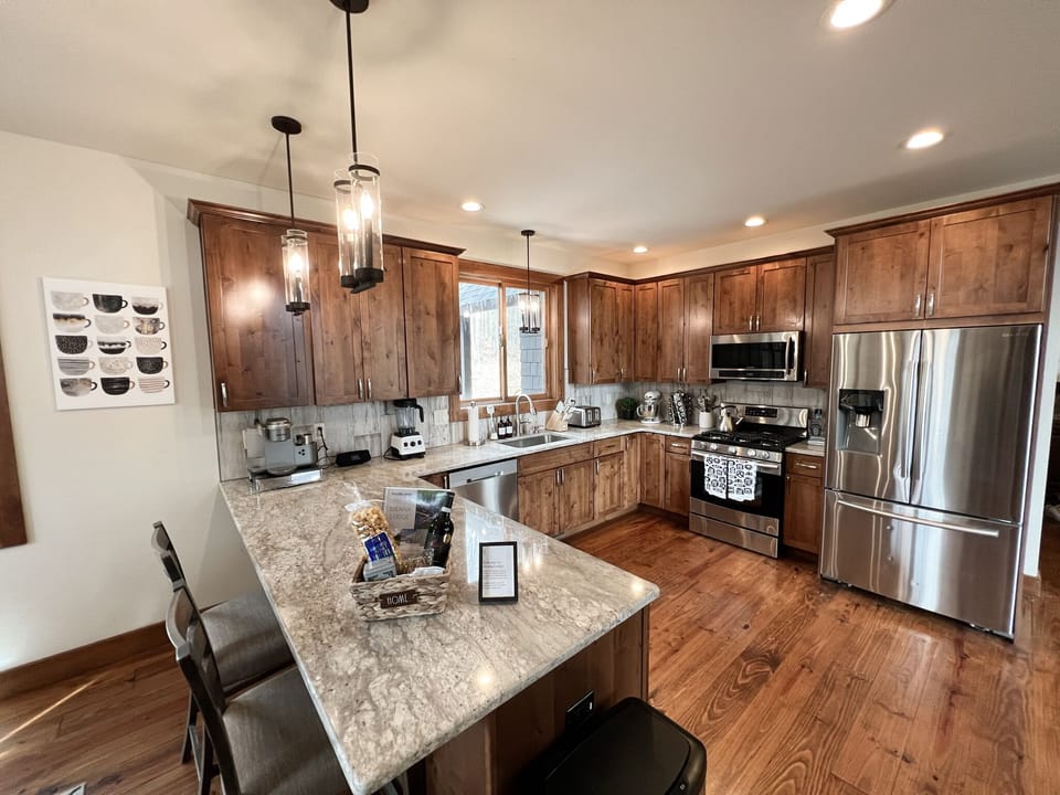 We have a large, fully stocked kitchen with modern, stainless steel appliances.