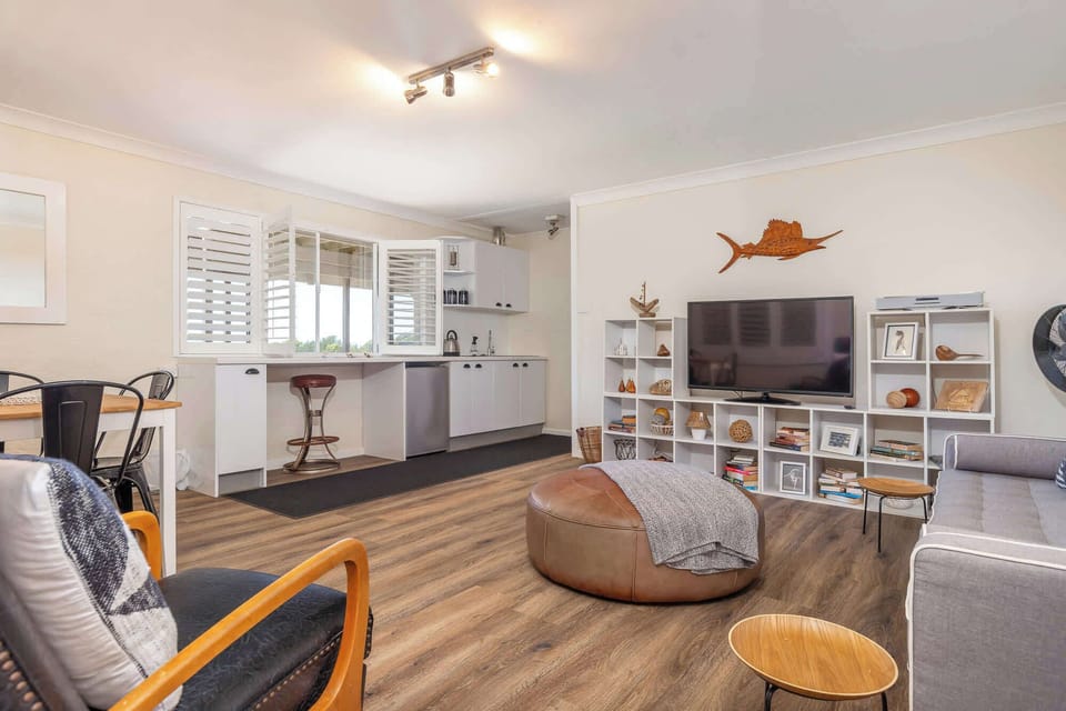 Lower level (external access only) - open plan living, dining and kitchenette area
