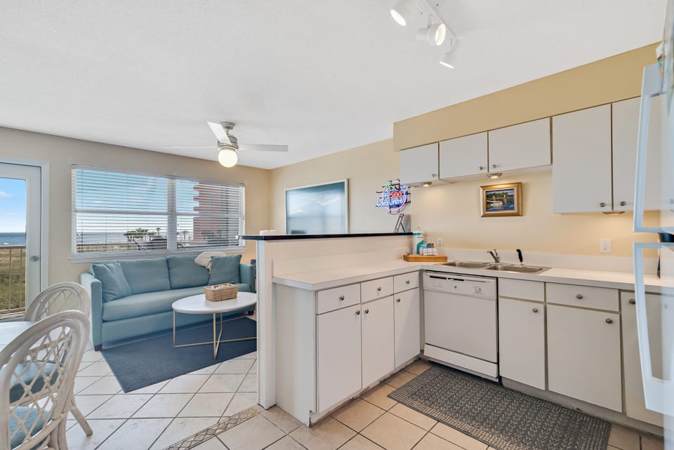 Enjoy the comforts of home, even on vacation. Our well-appointed kitchen at Summer Breeze Condominiums offers everything you need to brew your morning coffee, prepare snacks, or cook a full family dinner after a day at the beach.
