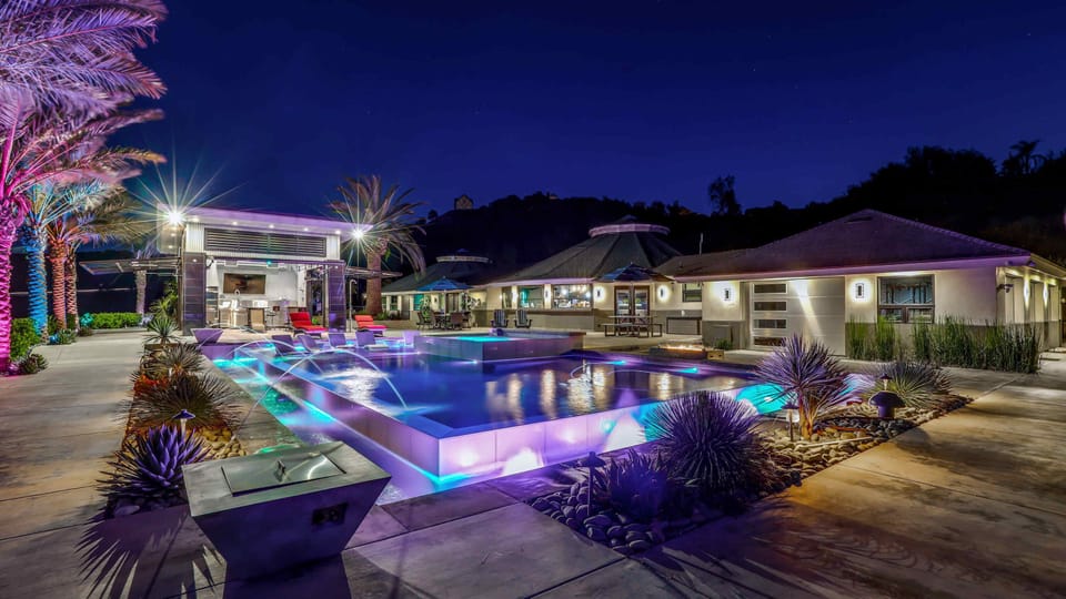 The estate glows with colorful lights and unforgettable nighttime vibes!