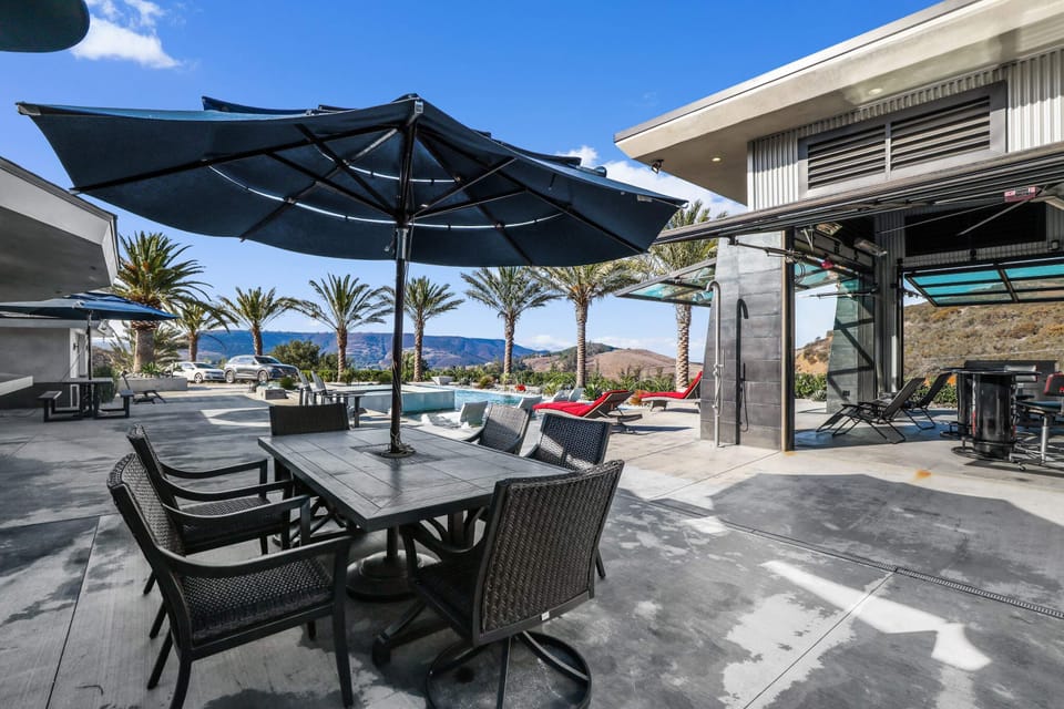 Alfresco dining with epic views of palms, hills, and skyline!