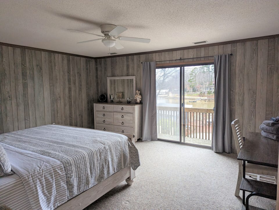 Bedroom One (Upstairs) with King Sized Bed and lakefront views.