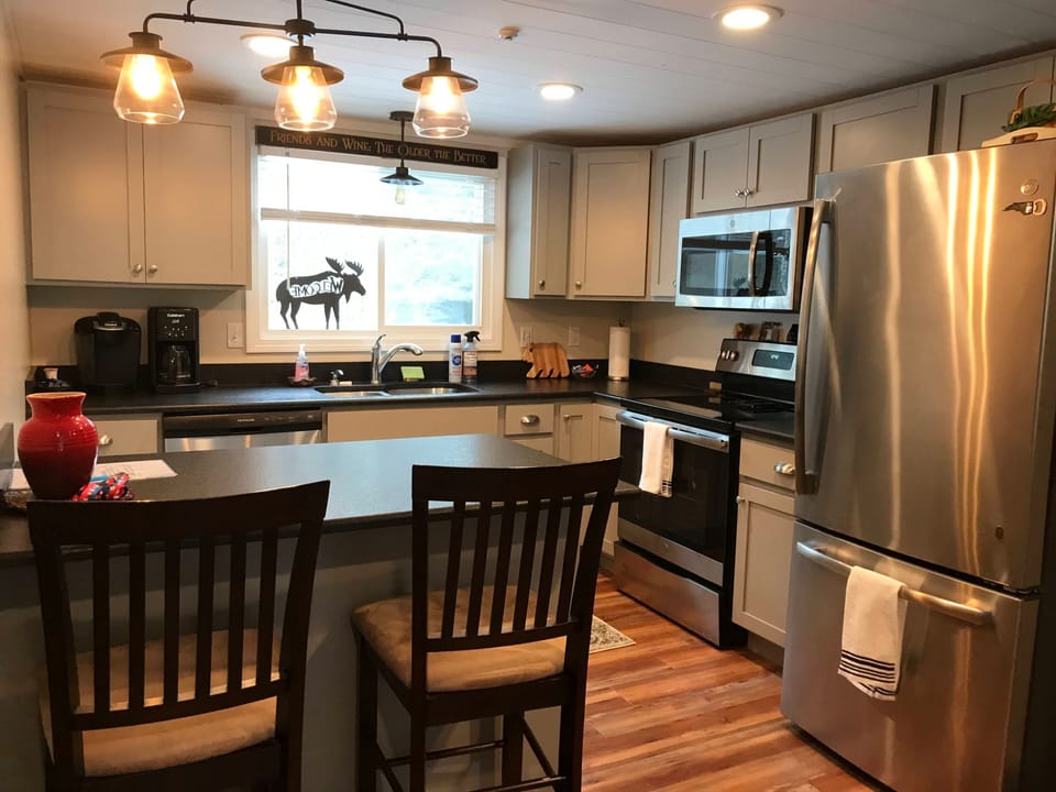 Granite countertops, stainless appliances and well- stocked kitchen