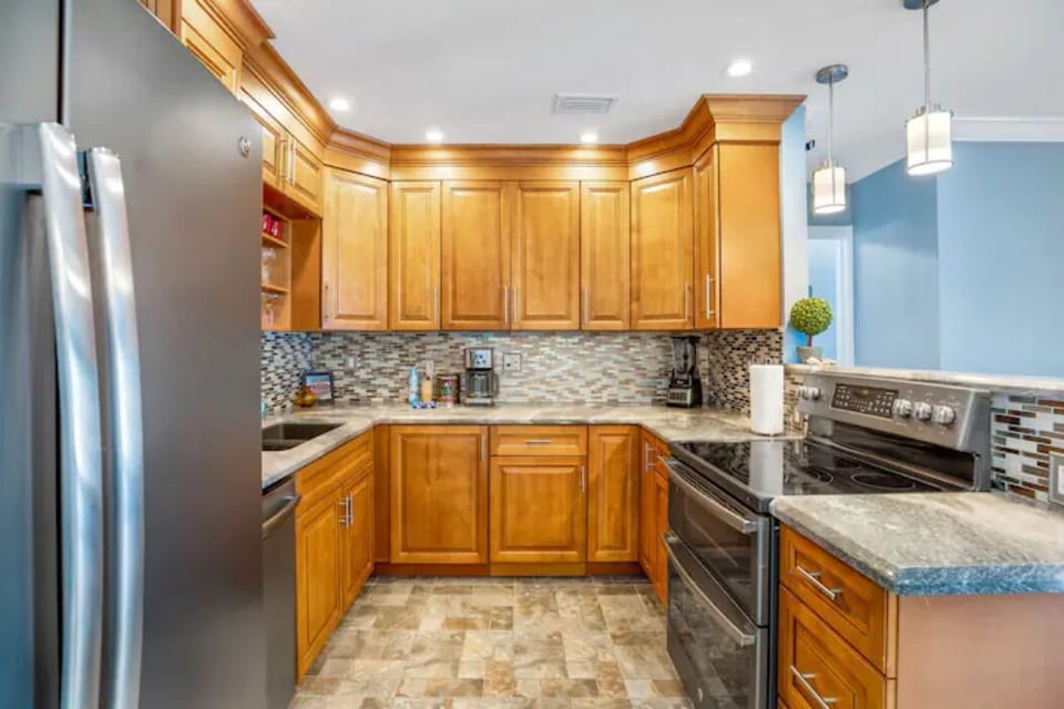 Full kitchen with all cooking utensils, pots and pan to cook a family feast.