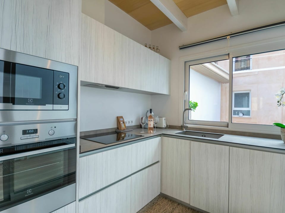Cabinetry, Countertop, Property, Window, Building, Tap, Plant, Kitchen Stove, Kitchen Sink, Kitchen Appliance