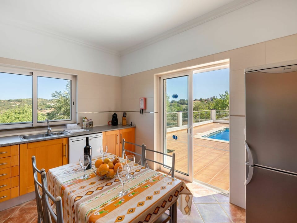 Countertop, Cabinetry, Property, Furniture, Window, Sink, Tap, Table, Wood, Kitchen Stove