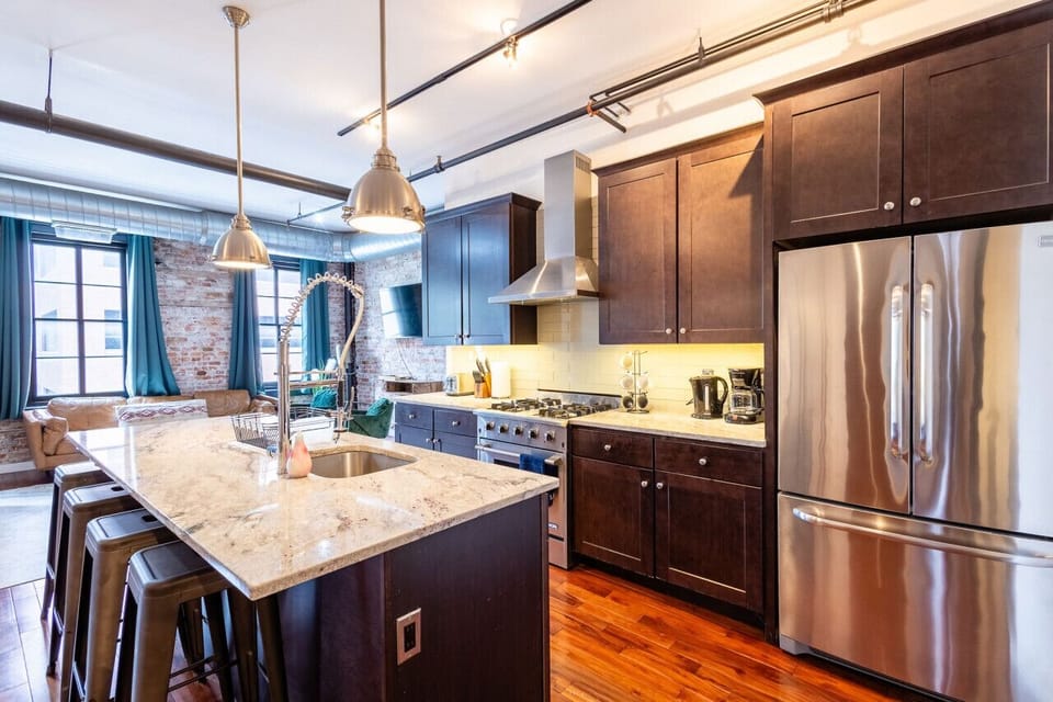 Modern kitchen with stainless-steel appliances and spacious countertops