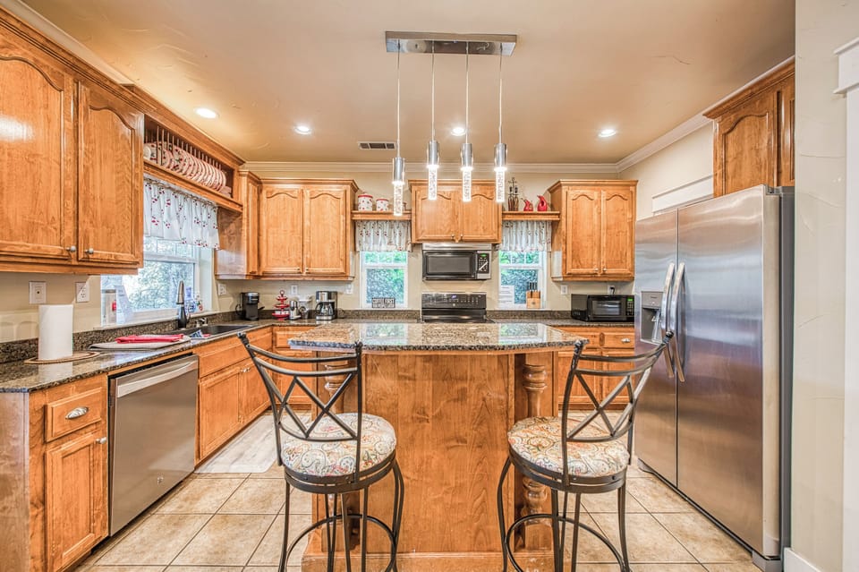 view of kitchen and 2 barstools at island